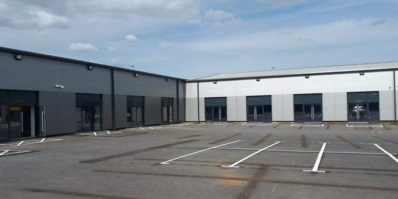 Exterior view of the modern grey and white industrial building at Orlando Street, Bolton.