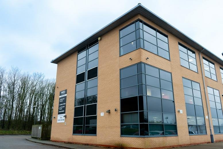 Exterior view of the brick and glass facade of Osprey House, Pegasus Business Park.