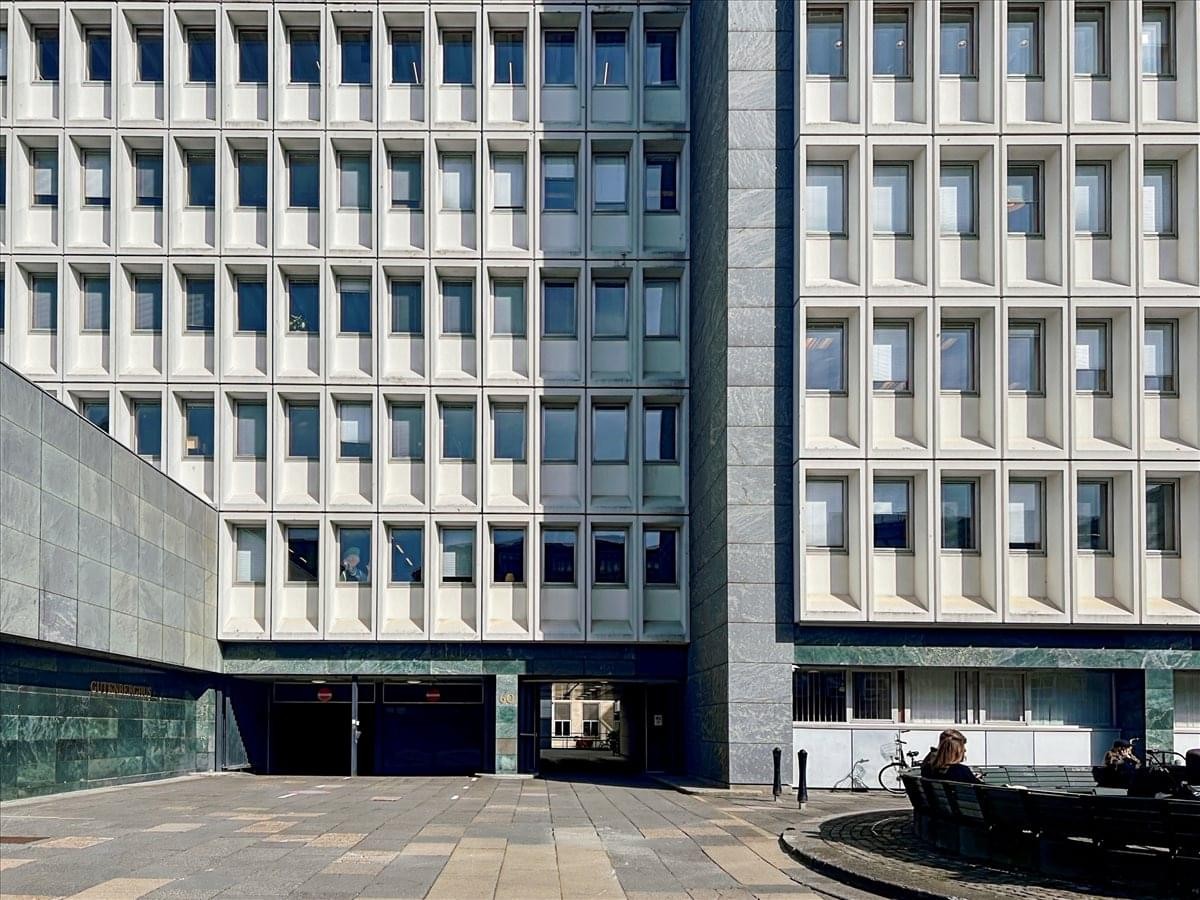 Exterior facade of the modernist concrete building at Pilestraede 58.