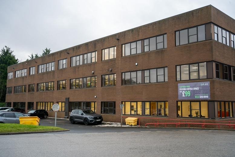 Exterior brick facade of Plateworks House, Riva Park, Coal Road, Leeds.