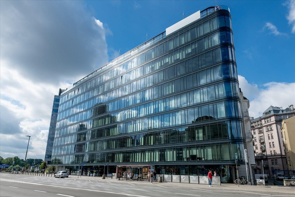 Exterior view of the modern glass-facade Polna Corner building at 3A Warynskiego street.