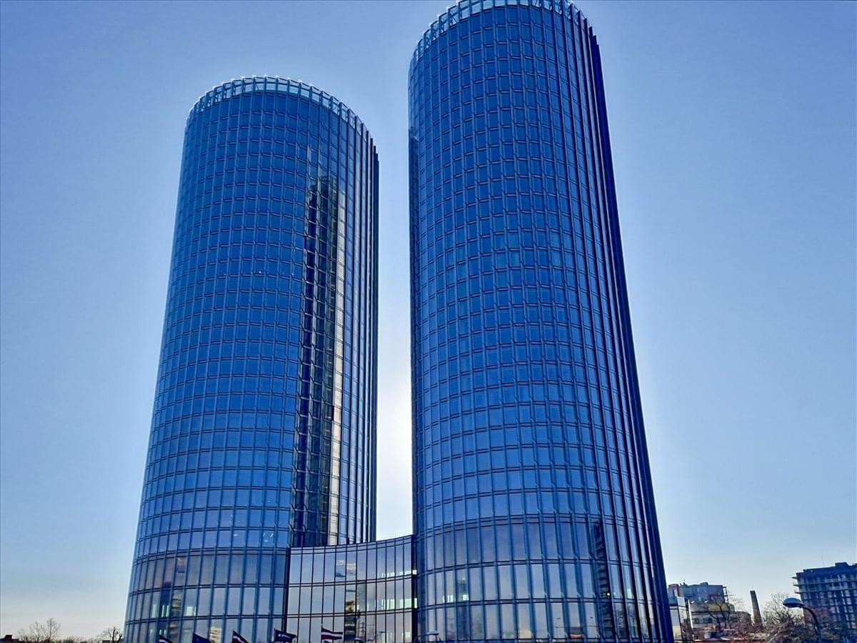Exterior view of the twin blue glass skyscrapers of Ranka Dambis 30, Zunda Towers.