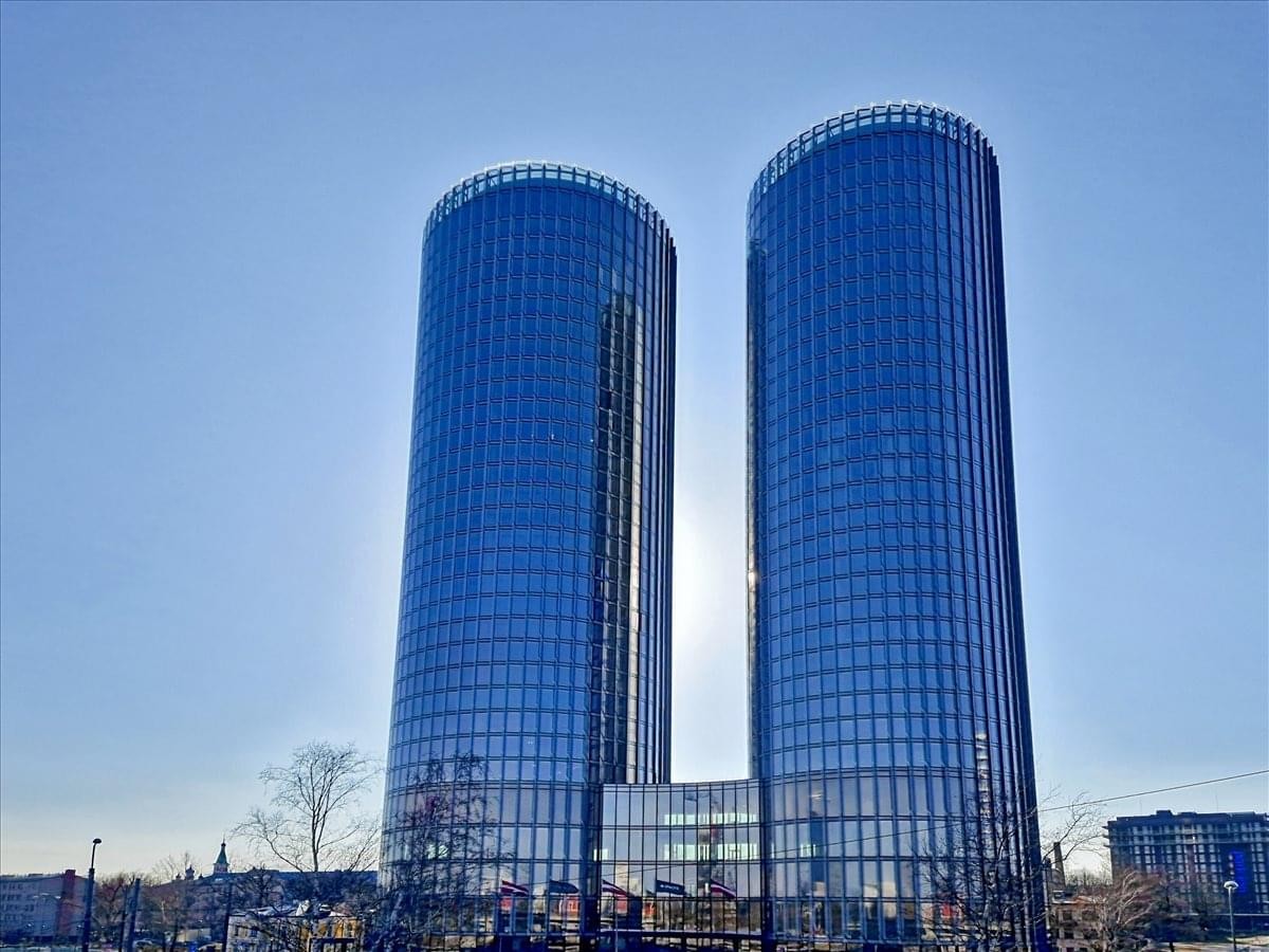 Exterior view of the twin glass-facade skyscrapers of the Zunda Towers.