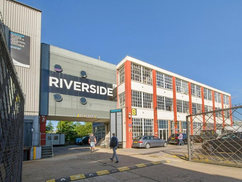 Exterior view of the multi-story Riverside Business Centre, Haldane Place featuring large windows.