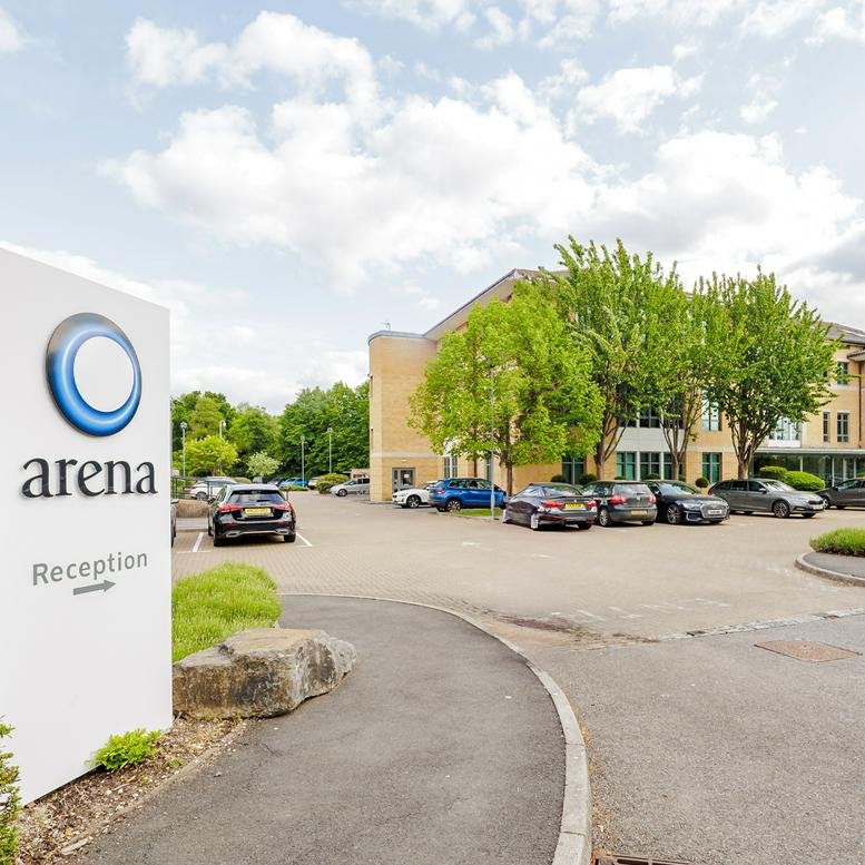Exterior view of the brick facade and parking at Building B, Riverside Way, Watchmoor Park, Camberley.
