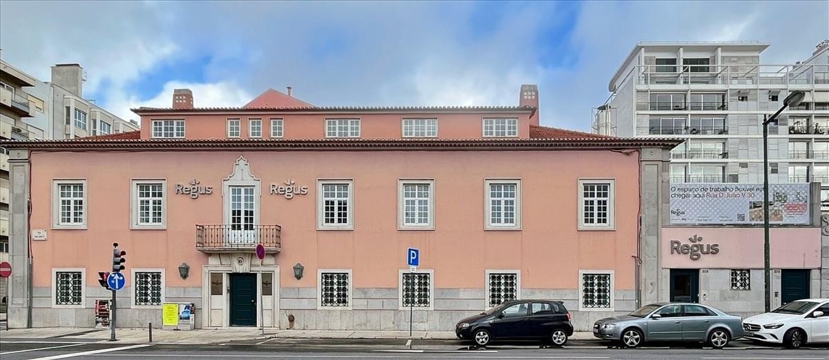 Exterior view of the peach-colored historic facade of Amoreiras Palace.