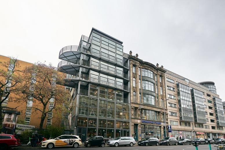 Exterior view of the modern glass and stone building at Rudi Dutschke Strasse 23.