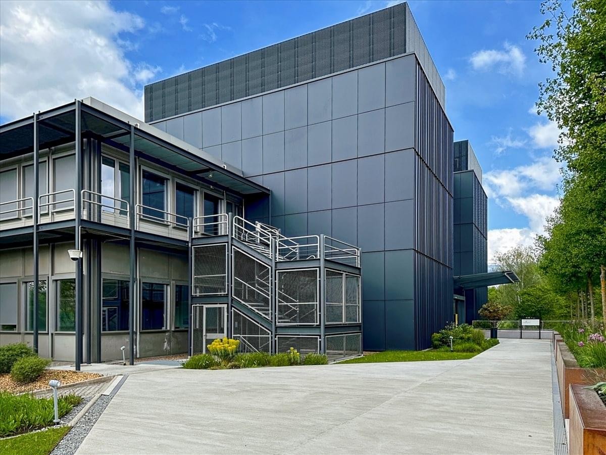 Exterior view of the modern gray and glass building at Rue du Nant D'avril 150, Meyrin.
