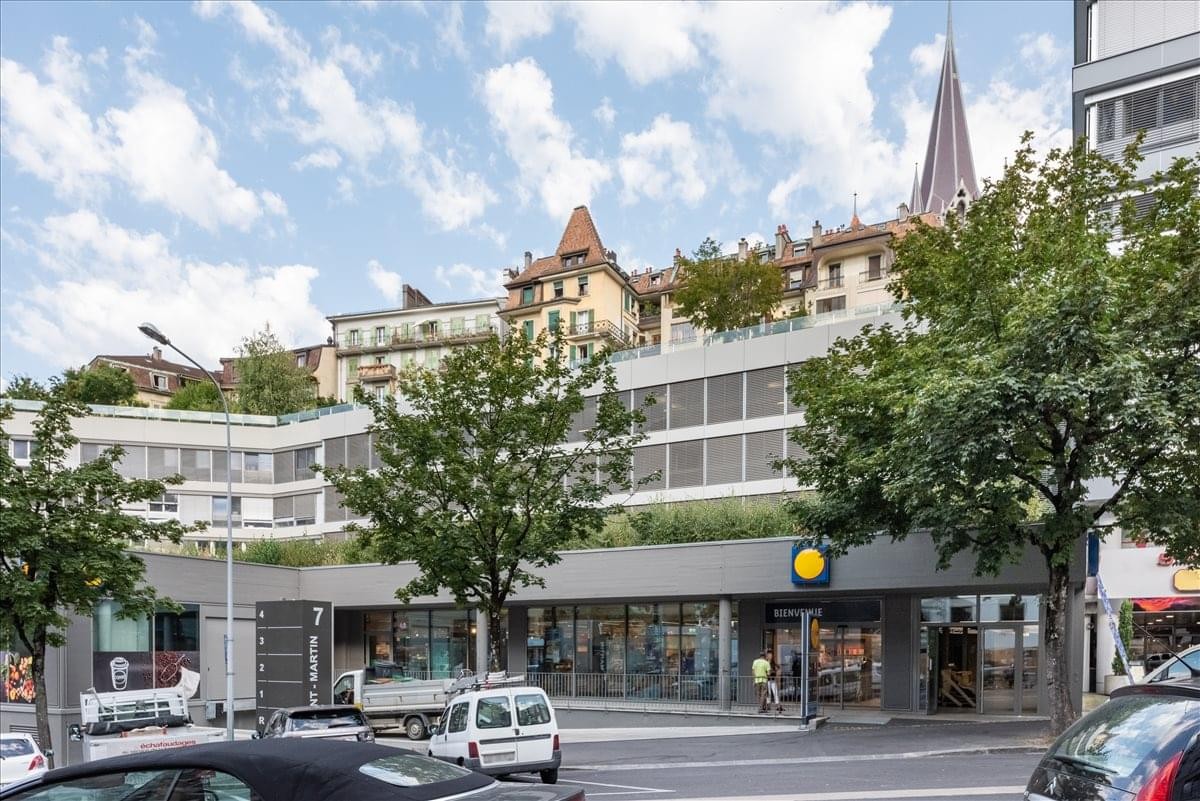 Exterior view of the building at Rue Saint-Martin 7, Lausanne, showing the facade and surrounding city architecture.
