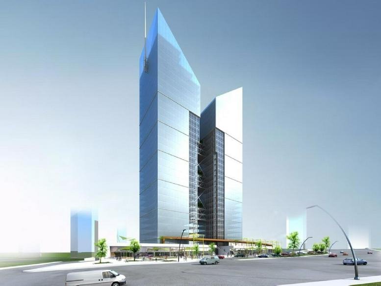 Exterior view of the modern glass-facade Koç İkiz Kuleler with its distinctive pointed roofline.