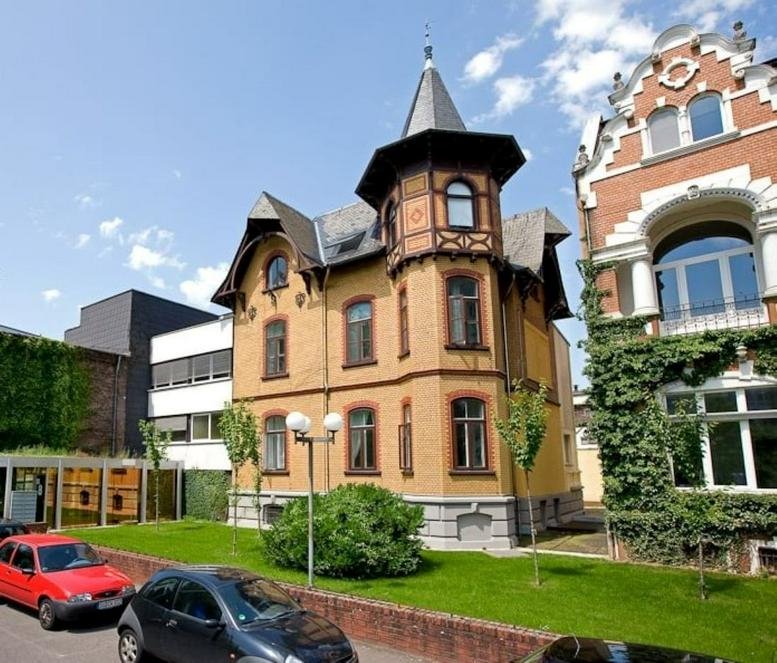 Exterior view of the historic brick and stone building at Siemensstrasse 15-19.