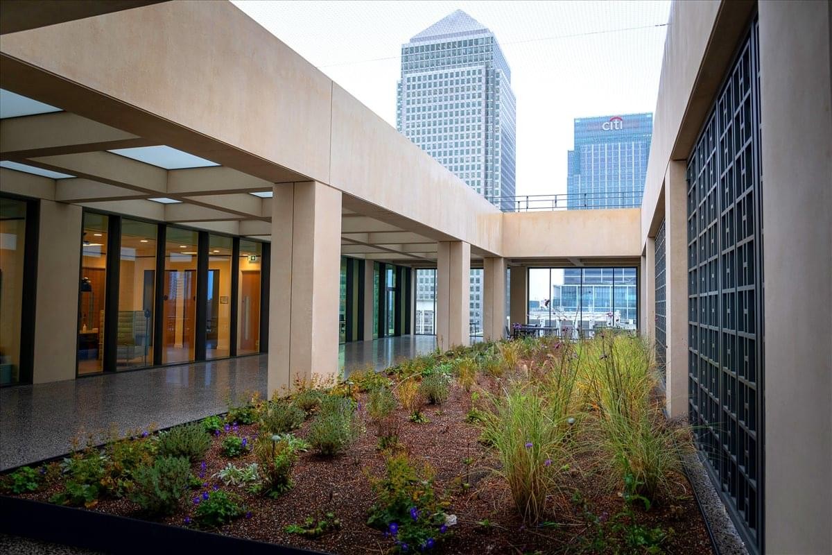 Spaces Canary Wharf, 25 Cabot Square, London outdoor terrace with greenery and city skyline views.