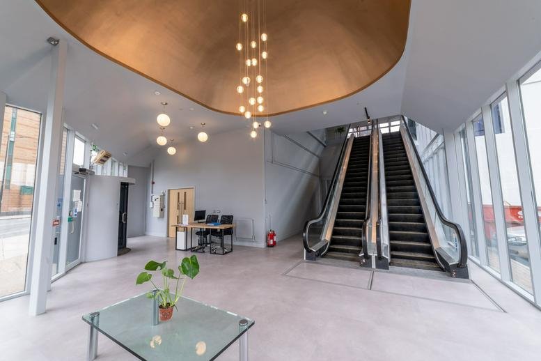Lobby at St. Clare House featuring a gold domed ceiling and stylish pendant lights.