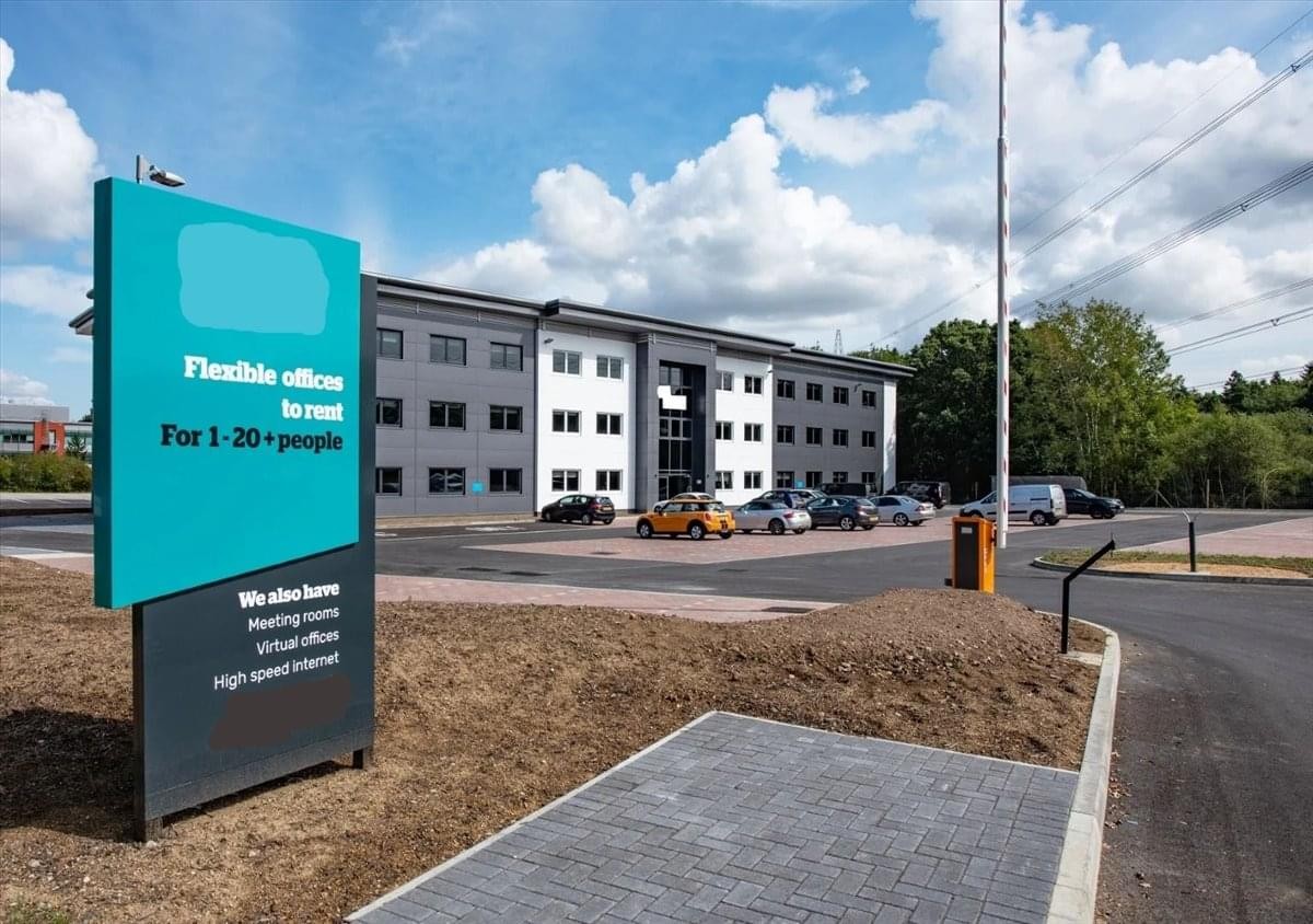 Exterior view of the modern Steel House, Plot 4300, Solent Business Park building with a teal entrance sign.