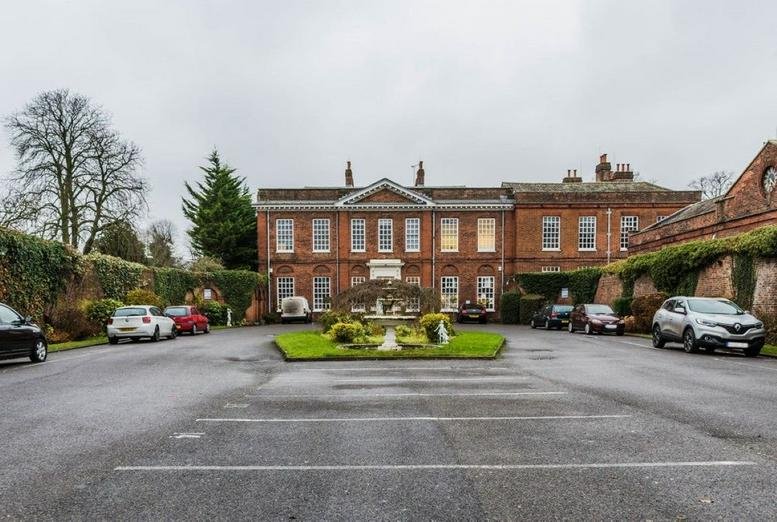 Exterior view of the historic red brick facade and entrance at Baylis House.