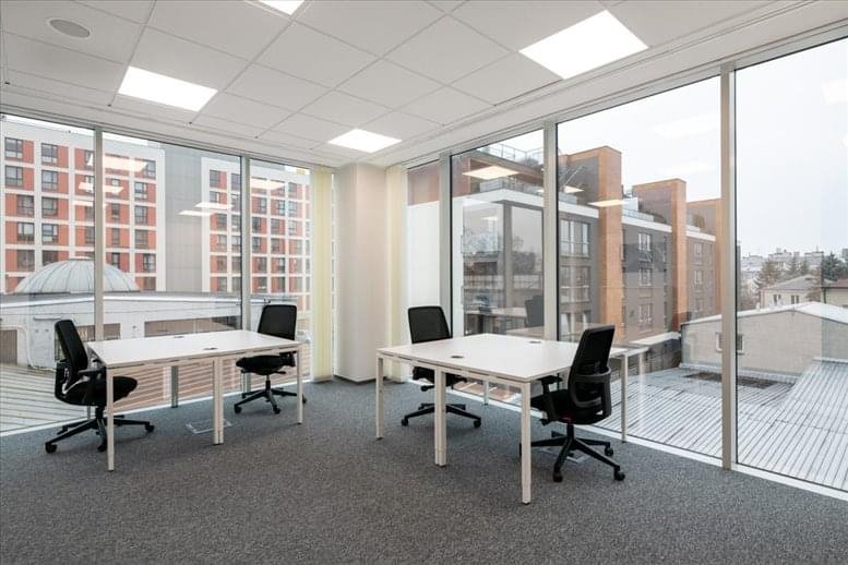 Spacious corner office at Stuart House with two desks and floor-to-ceiling windows.
