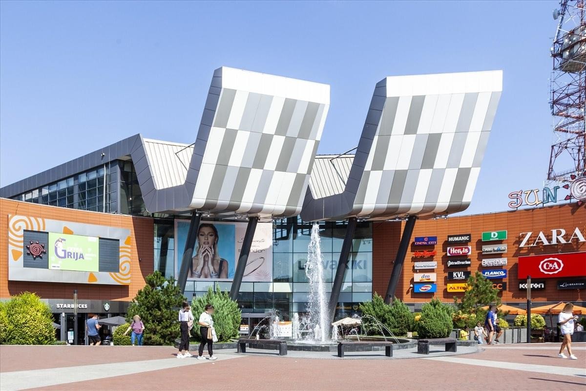 Exterior view of the modern Sun Plaza Shopping Centre building with distinctive angled roof structures.