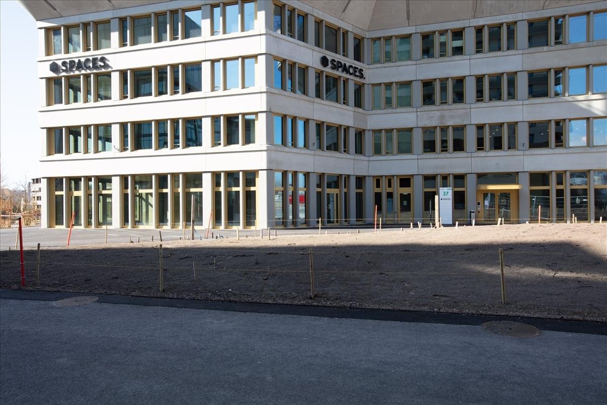 Exterior facade of the modern Suurstoffi 37 office building with large windows.