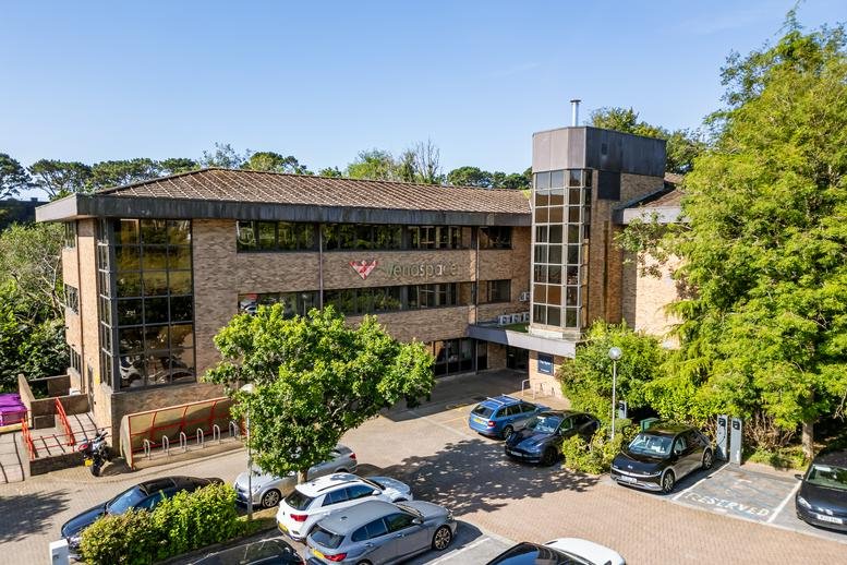 Exterior view of the brick-and-glass facade of The Apex, Derriford Business Park.