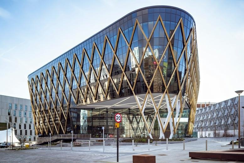 Exterior view of the striking glass and gold-lattice facade of The Catalyst, 3 Science Square.
