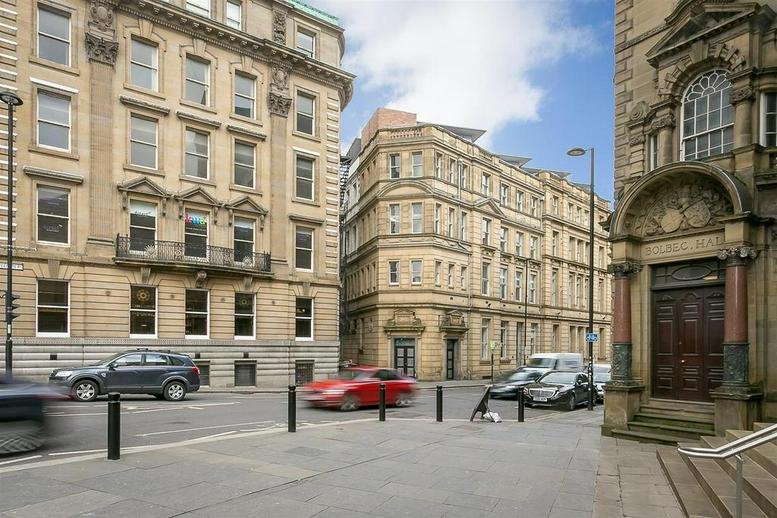 Exterior view of the historic stone-facade building of The Chamber Hub, Westgate Road.