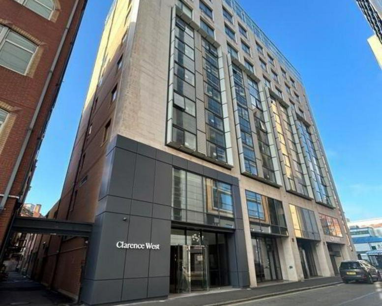 Exterior view of the modern stone and glass facade of The Clarence West Building.