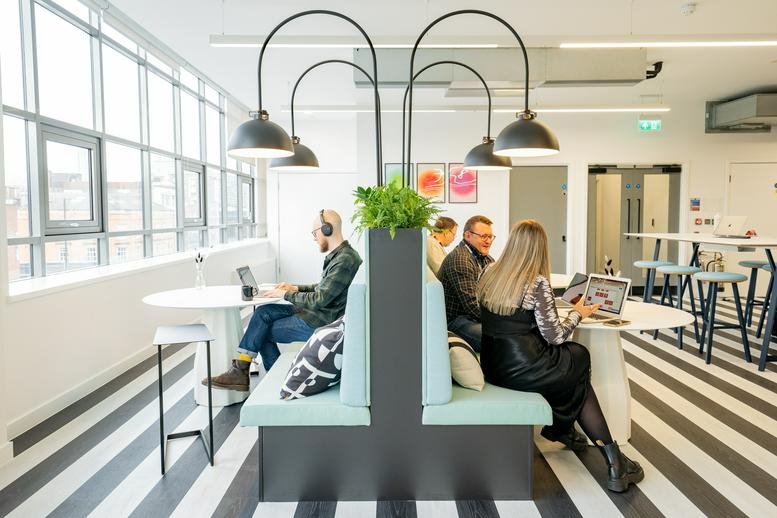 The common area at The Express Building, 9 Great Ancoats Street, Manchester with multi-tiered lighting.