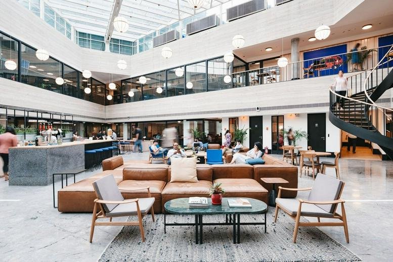Spacious communal lounge and coworking hub at The Hanover Building, Corporation Street, Manchester.