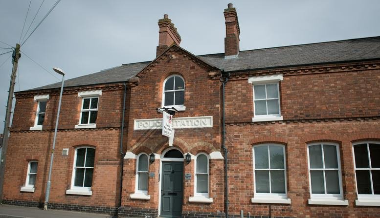 Exterior view of the red brick facade at The Old Police Station, South Street, Ashby-de-la-Zouch.