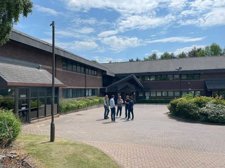 Exterior view of the brick facade and entrance at The Tax Office, Pentland Park, Glenrothes, Fife.