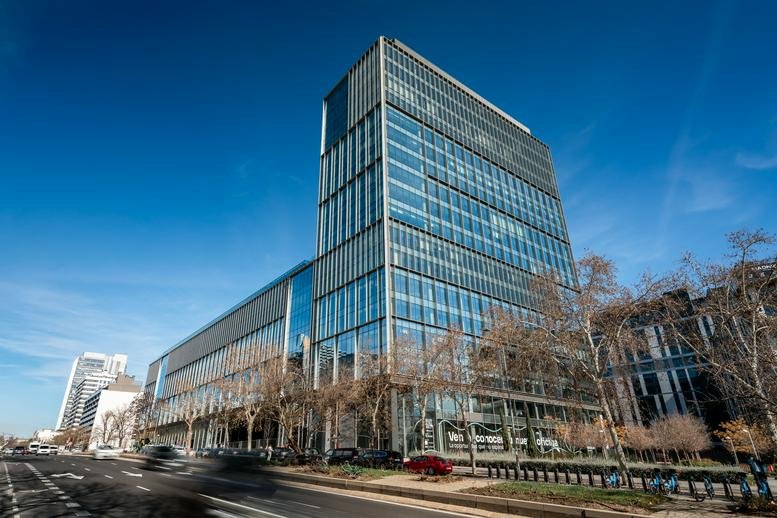 Exterior view of the glass-facade Torre Oriente building on a clear day.