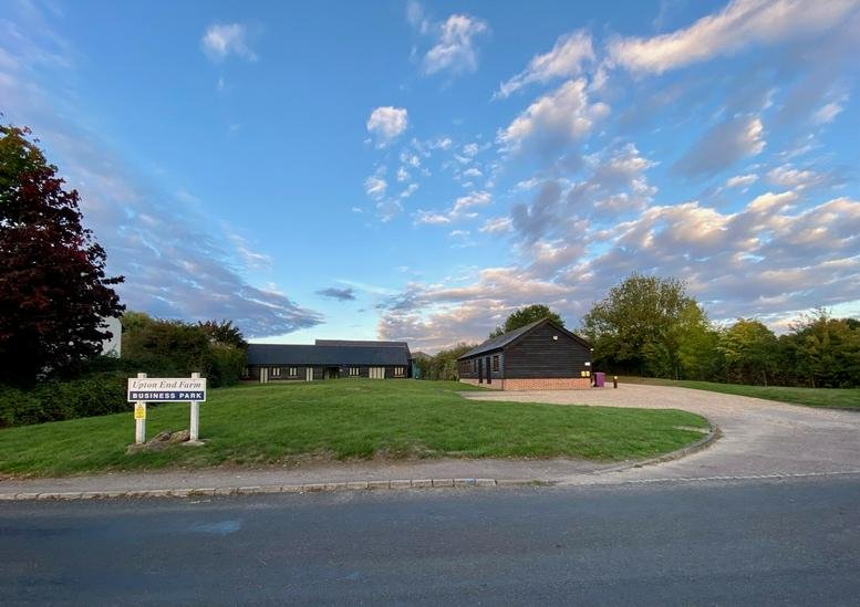 Exterior view of the black timber-clad office buildings at Upton End Road and Meppershall Road.