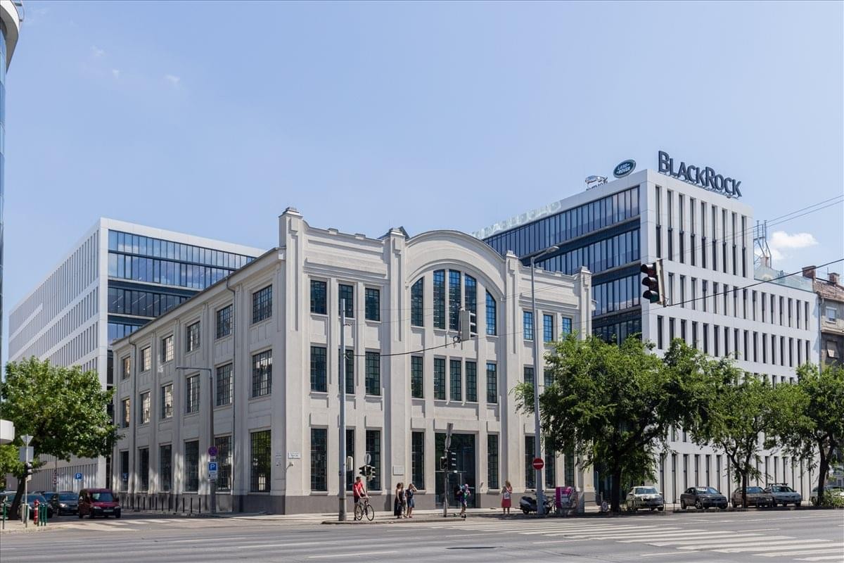 Exterior view of the historic facade and modern glass addition at Váci út 47, Budapest.