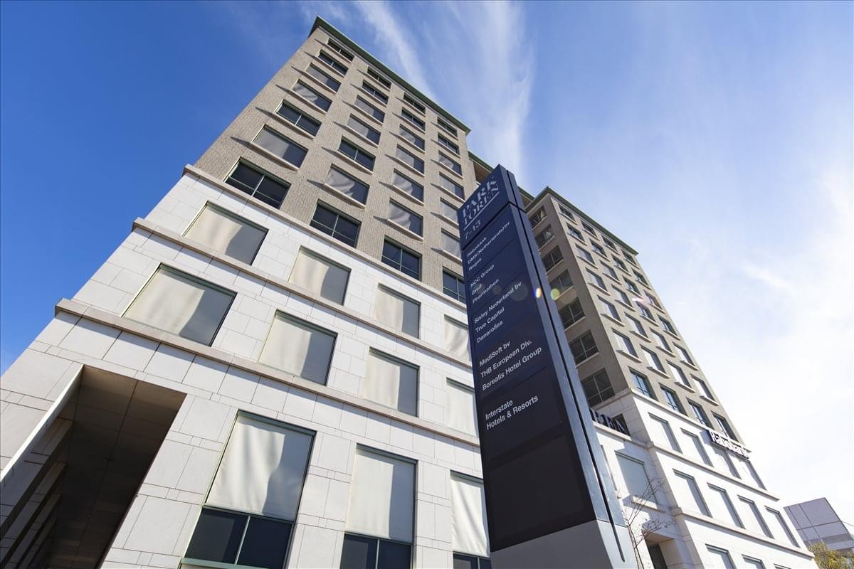 High-angle exterior view of the modern stone and glass facade at Van Heuven Goedhartlaan 13D.