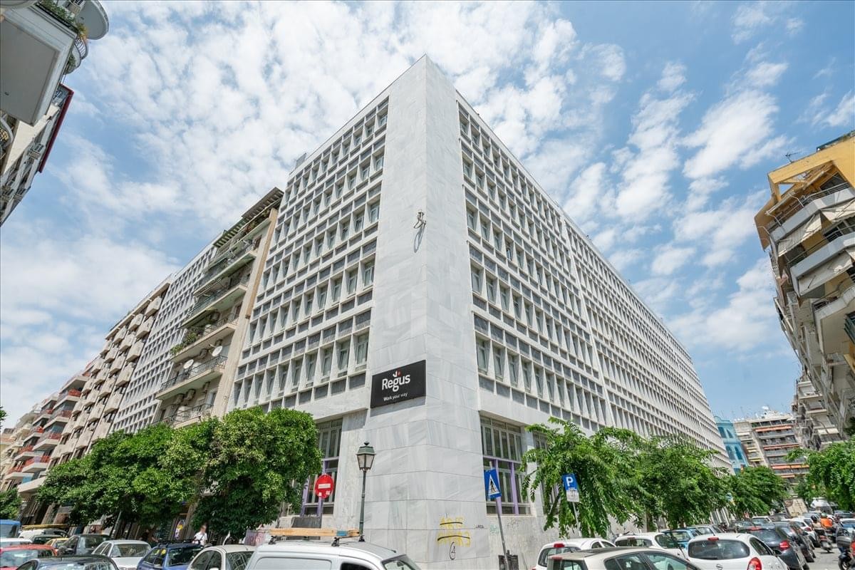 Exterior view of the white modern building at Vasileos Irakleiou 53 & Karolou Ntil.