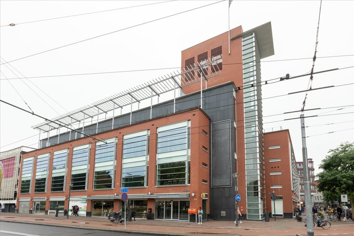 Exterior view of the red brick and glass building at Velperplein 23-25.