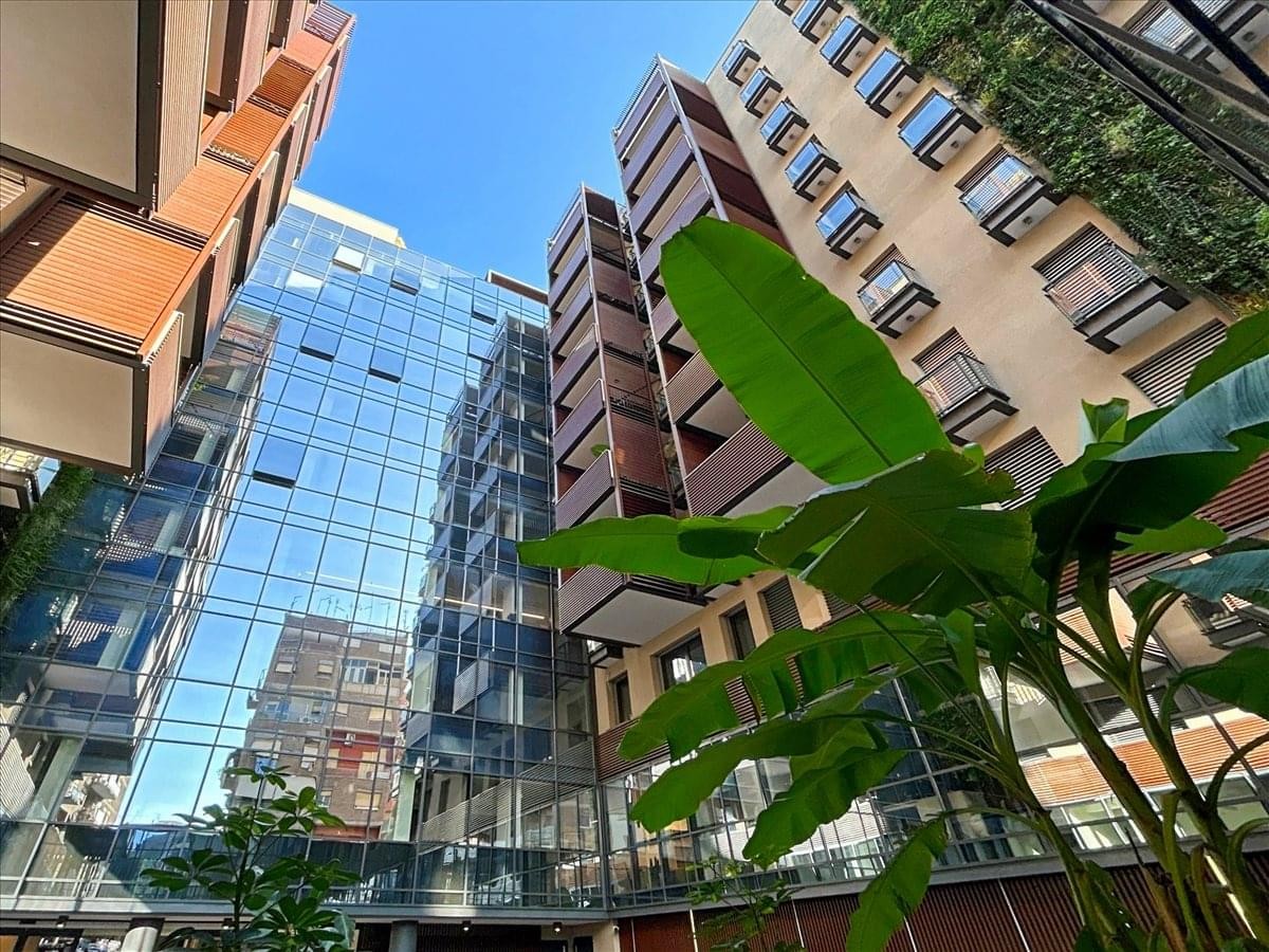 Exterior view of the contemporary glass and terraced facade of the Via Crescenzo Del Monte, No. 25, Rome building.