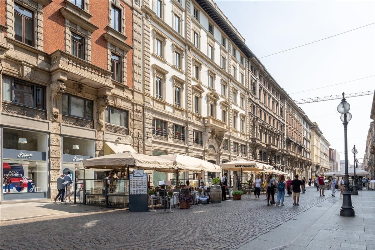 Exterior view of the historic architecture building at Via Dante 16, Milan, Italy.