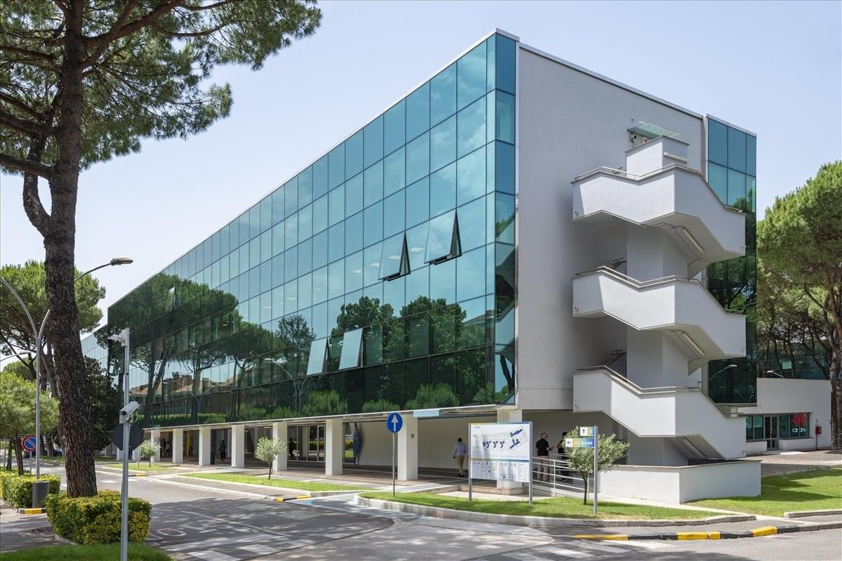 Exterior of the glass-facade Via del Serafico, 89/91, EUR Business District, Rome office building.