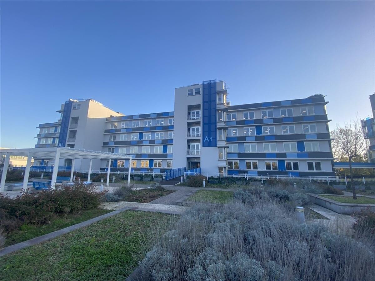 Exterior view of the modern multi-story office building at Via Rivoltana 2d, Segrate.