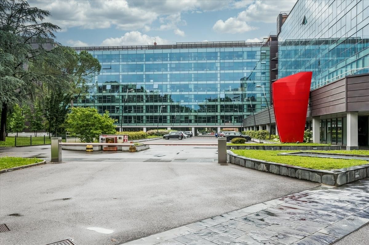Exterior view of the glass-facade Palazzo C building at Via Volta, 16 in Cologno Monzese.