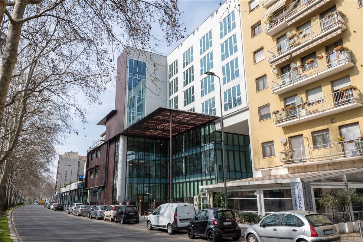 Exterior view of the contemporary multi-story building at Viale Cassala n. 57.