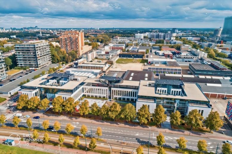 Aerial view of the Volmerlaan 5 building complex showing its modern architecture and surroundings.