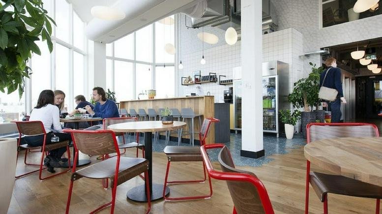 Spacious communal cafe and coworking area at Weesperstraat 61-105, Plantage, Amsterdam, Netherlands.