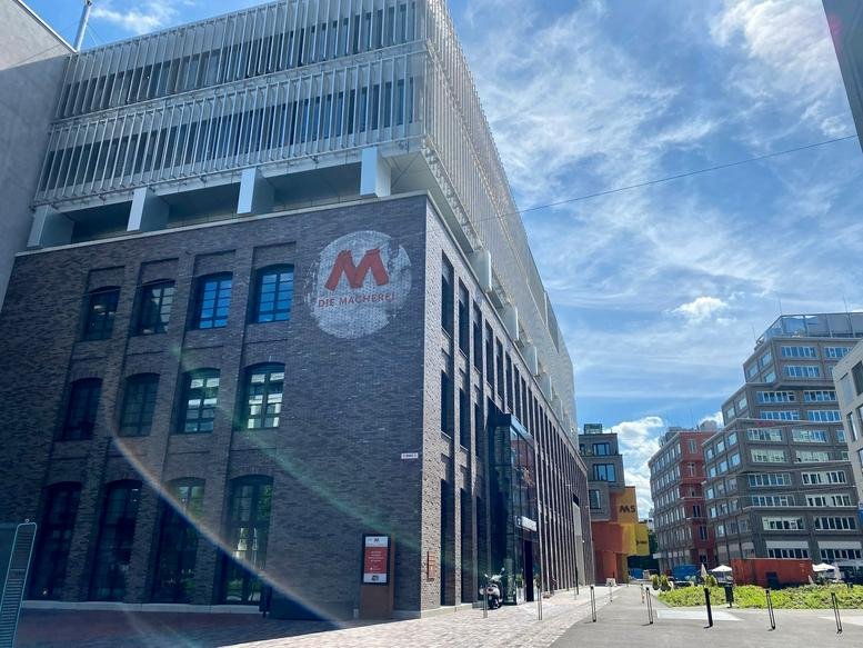 Exterior view of the brick and glass building at Weihenstephaner Str. 28-30, Munich, Bavaria.