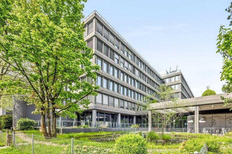 Exterior view of the multi-story office building at Weltpoststrasse 5.
