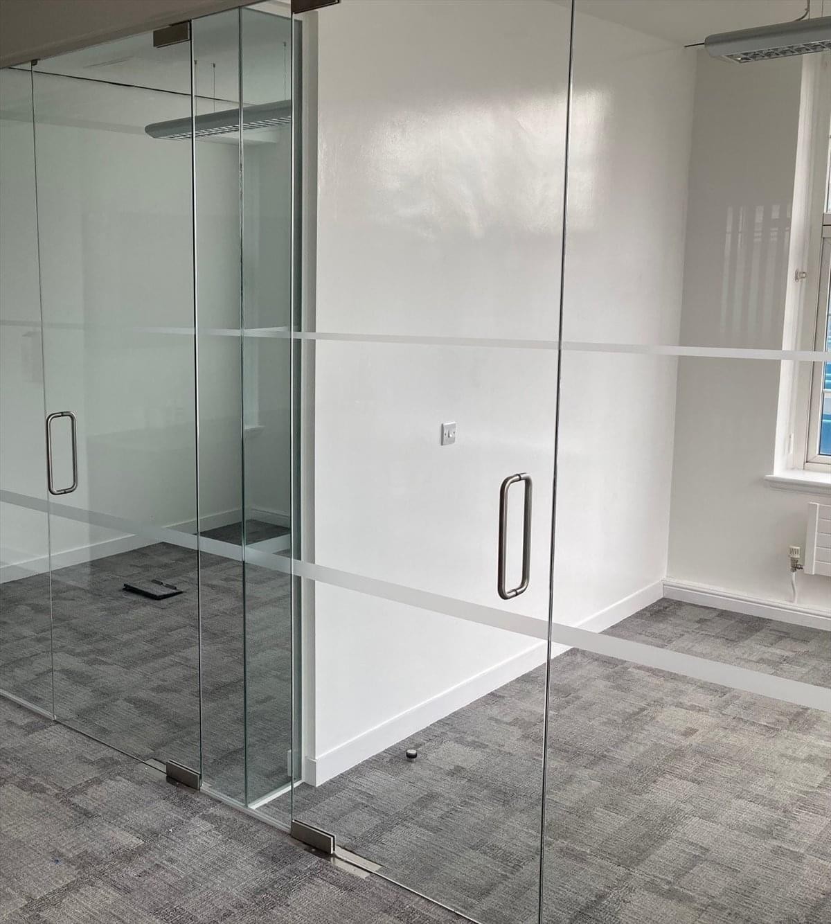 Bright glass-partitioned office at 346 Kensington High Street.