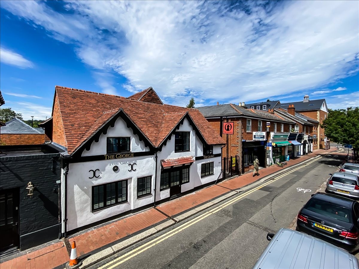 Traditional white and black timber-framed exterior of 45 Guildford Street, Chertsey, Surrey.