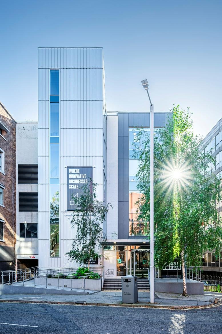 Exterior view of the modern white and grey facade at The Poynt Building, 45 Wollaton Street.