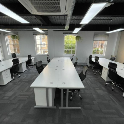 Modern open-plan workspace with white desks and black chairs, 2 Bath Place, Shoreditch, London